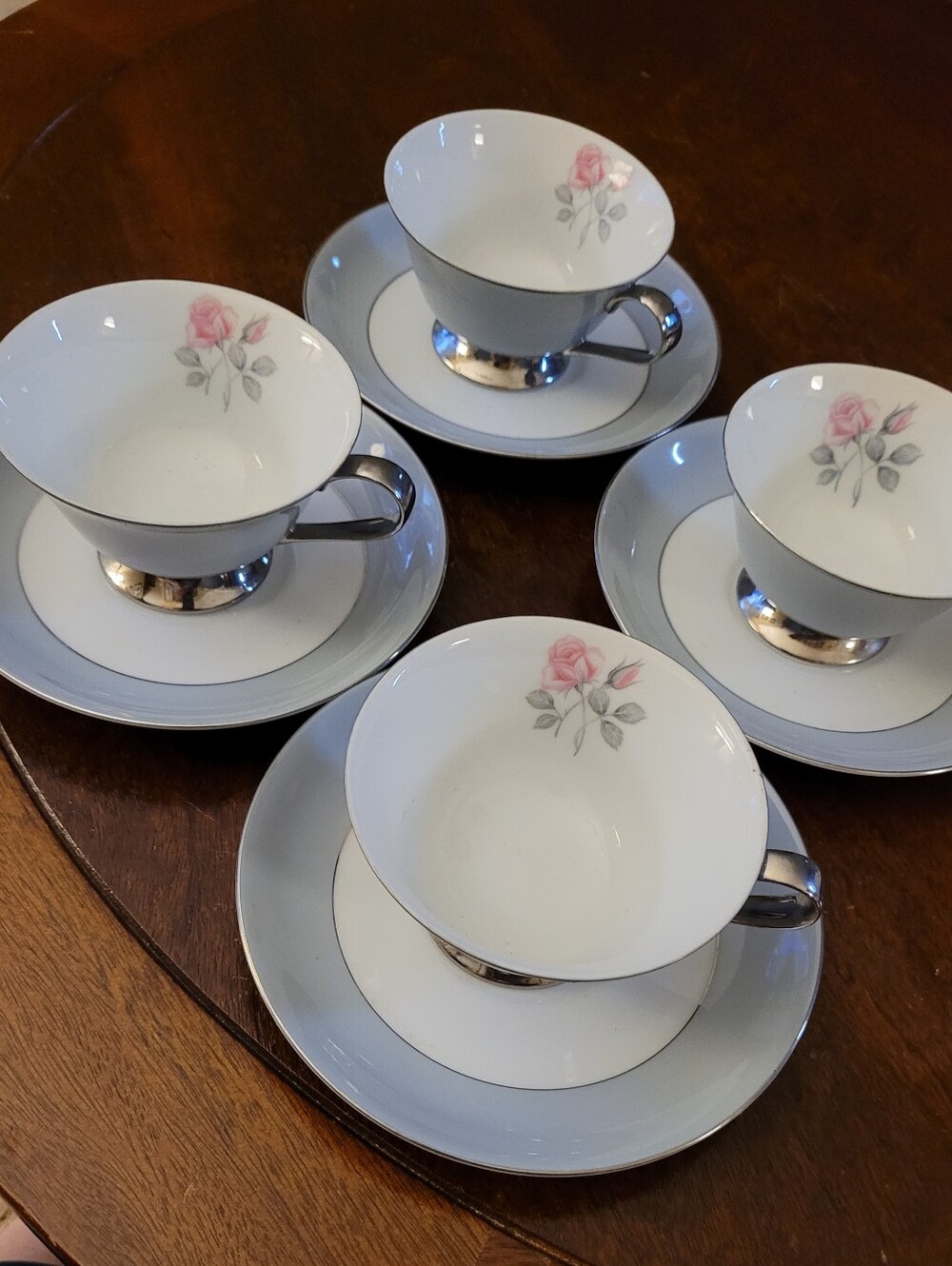 Set Of 4 Rose DeVille fine china teacups and saucers by DeVille.